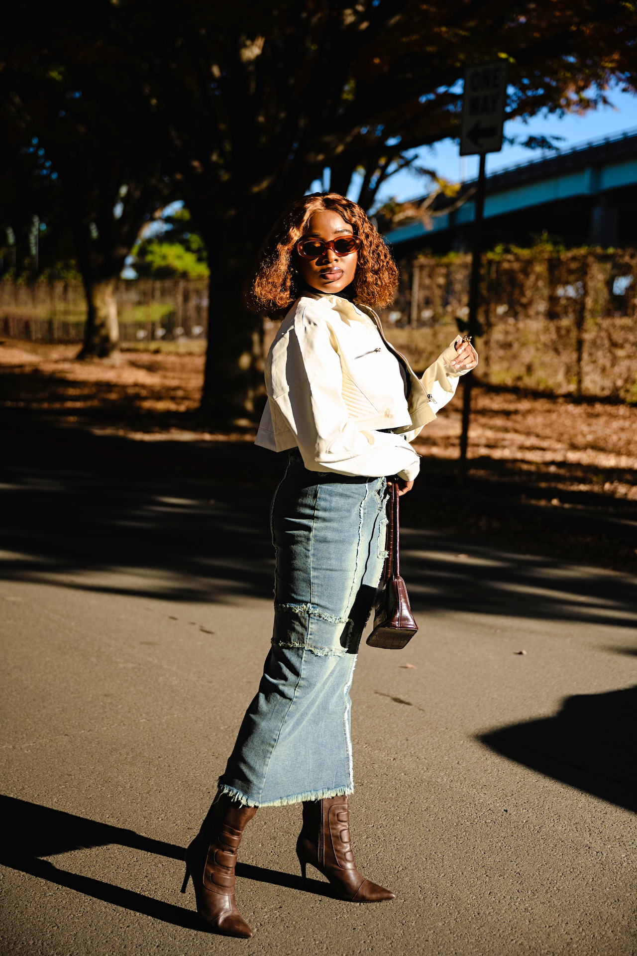 how to style a cropped leather jacket and denim skirt